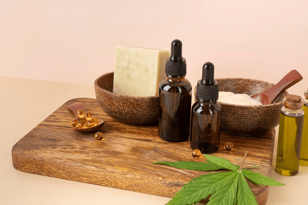 tincture bottles sitting on a wooden board with bowls 